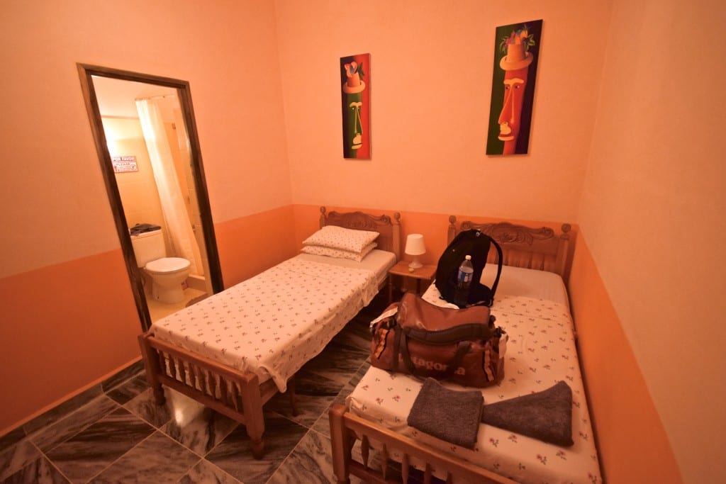 A bedroom with a two beds