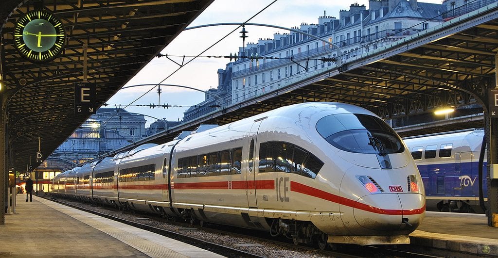 A passenger train pulling into a station