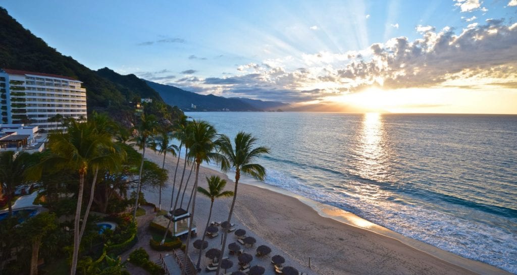 How to Book Hyatt's Incredible All-Inclusive Resorts with Points 1 A view of a beach next to a body of water