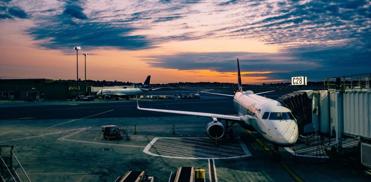 A large passenger jet sitting on top of a tarmac at an airport
