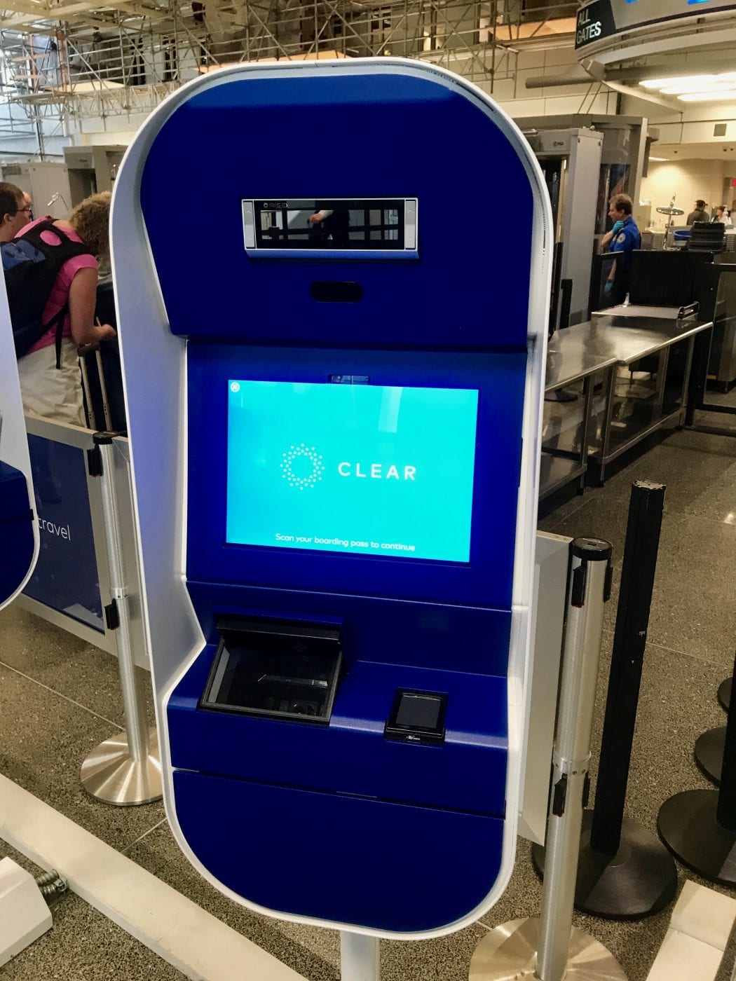 Will CLEAR's Lane of the Future Pods Fix Its Woes? Our Firsthand Look 4 A CLEAR kiosk in blue with a bright blue screen, eyeball scanners on the top, and fingerprint scanners on the bottom.