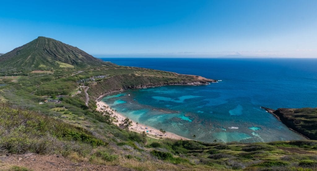 Thrifty Traveler's Guide to Oahu, Hawaii 2 A body of water with a mountain in the ocean