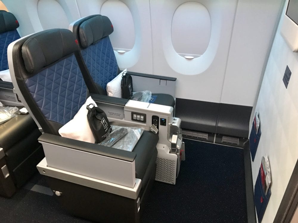 Can You Upgrade with Miles After Buying a Cheap Flight? 16 two delta premium select seats with amenity kits and pillows