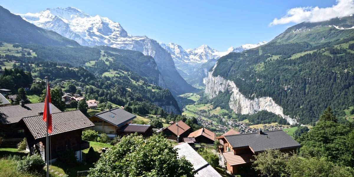 A view of a house with a mountain in the background