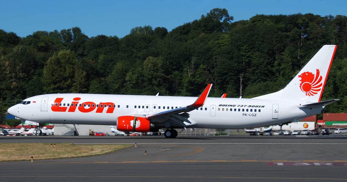 A large passenger jet sitting on top of a runway