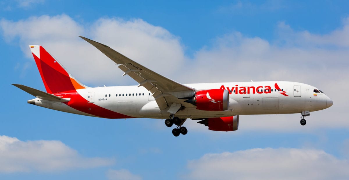 SAS Files for Bankruptcy Amid Pilot Strike, Mass Cancellations 2 A large Avianca passenger jet flying through a cloudy blue sky