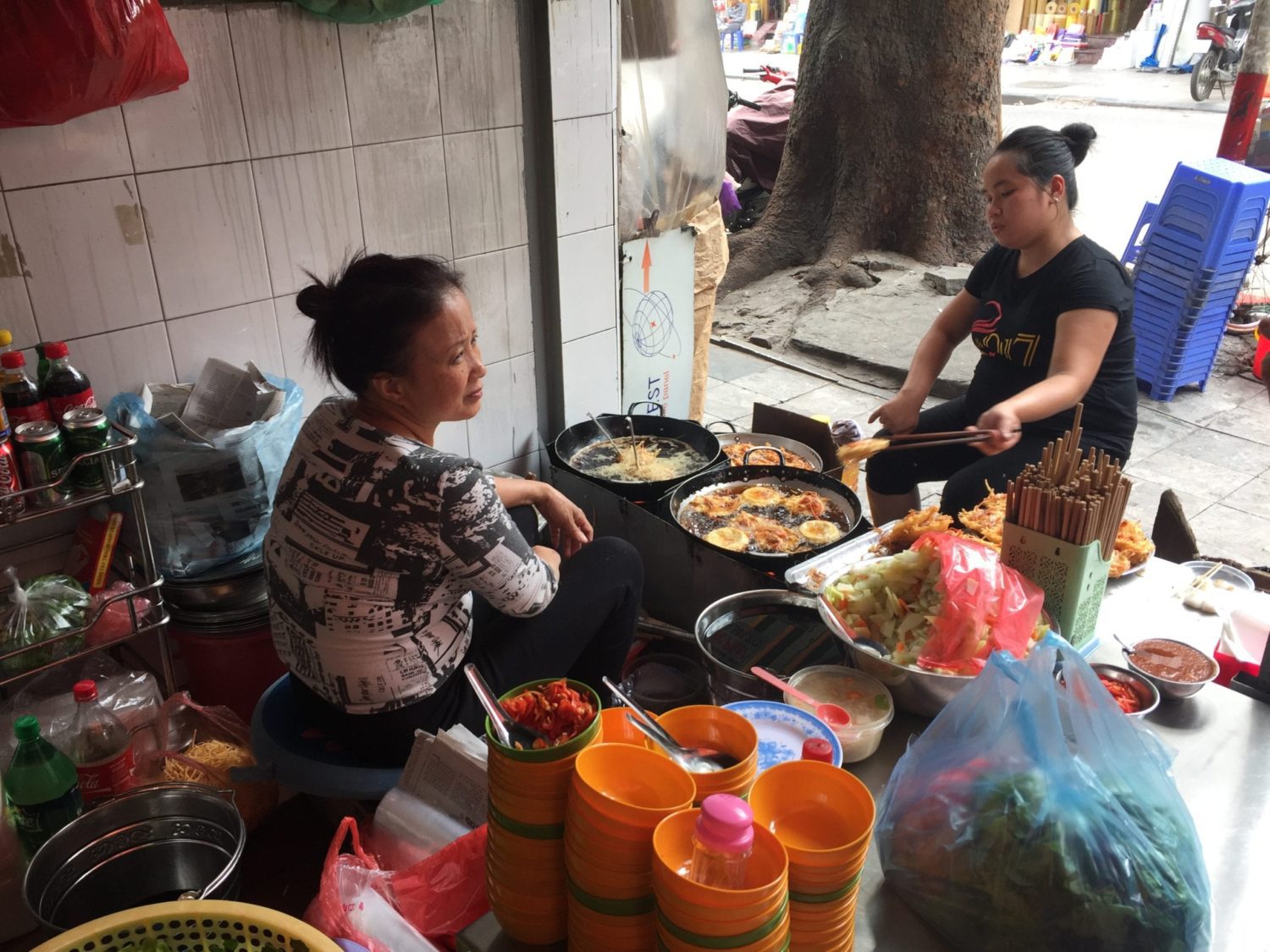 A group of people sitting at a table with a plate of food