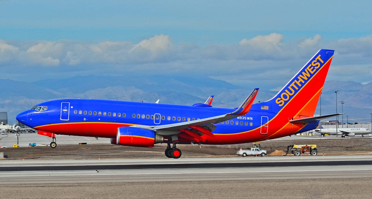A large passenger jet sitting on top of a runway