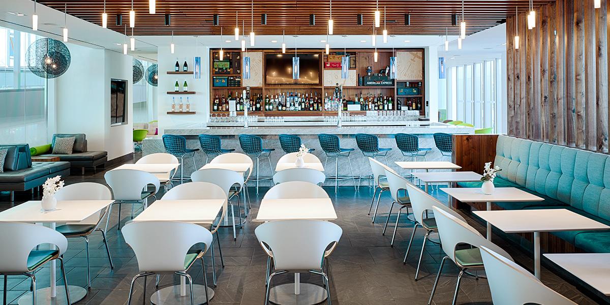 a long bar with tables in front of it