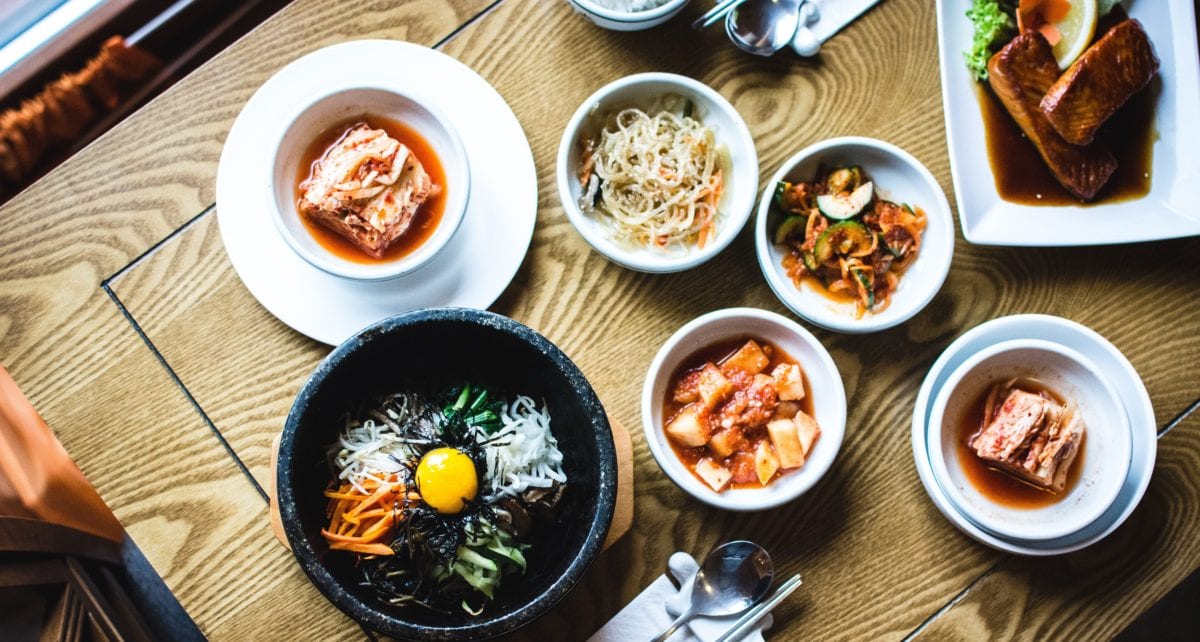 A bowl of food on a table, with Restaurant