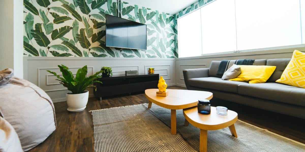 A living room filled with furniture and a large window