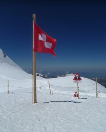 4 Small Towns in Switzerland You Need to Visit 11 A sign on the side of a snow covered slope