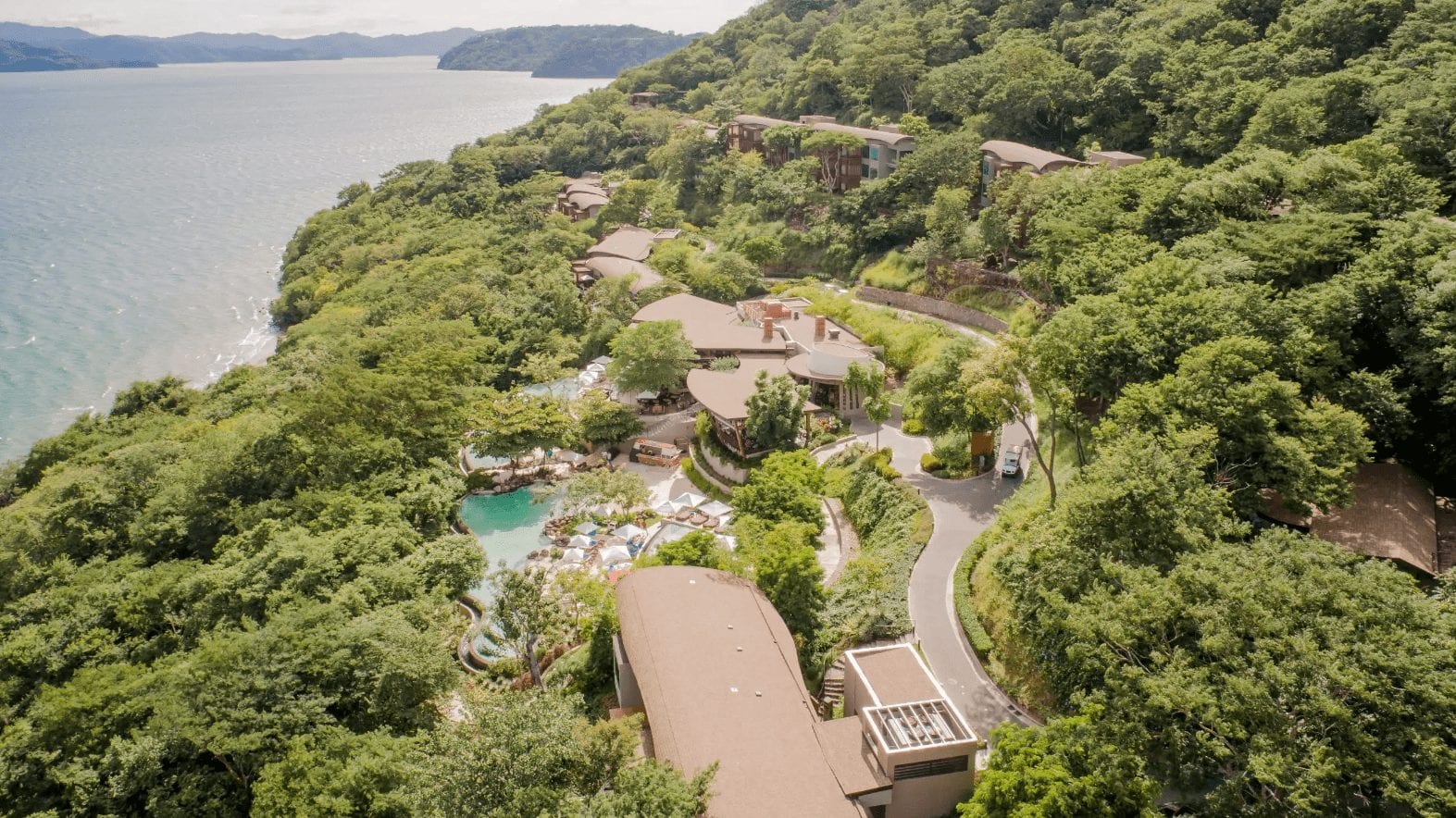 A close up of a hillside next to a body of water