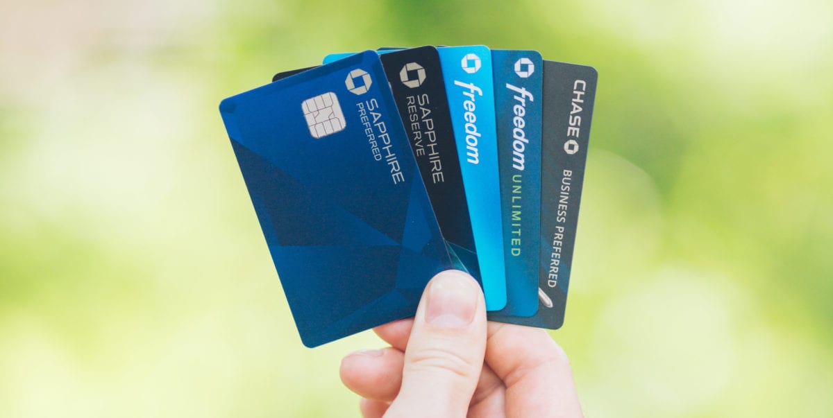 Learn From Us: Avoid These 6 Travel Credit Card Mistakes 2 A hand holding up five Chase credit cards
