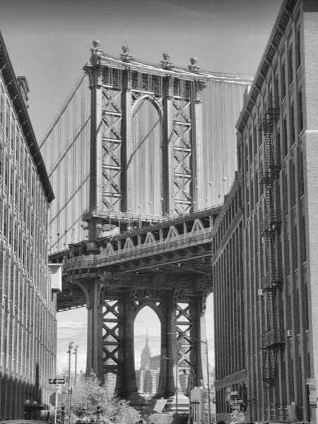 Step Into DUMBO, Brooklyn: How to Spend a Day in NYC's Hip Spot 7 A large building with a bridge in the background