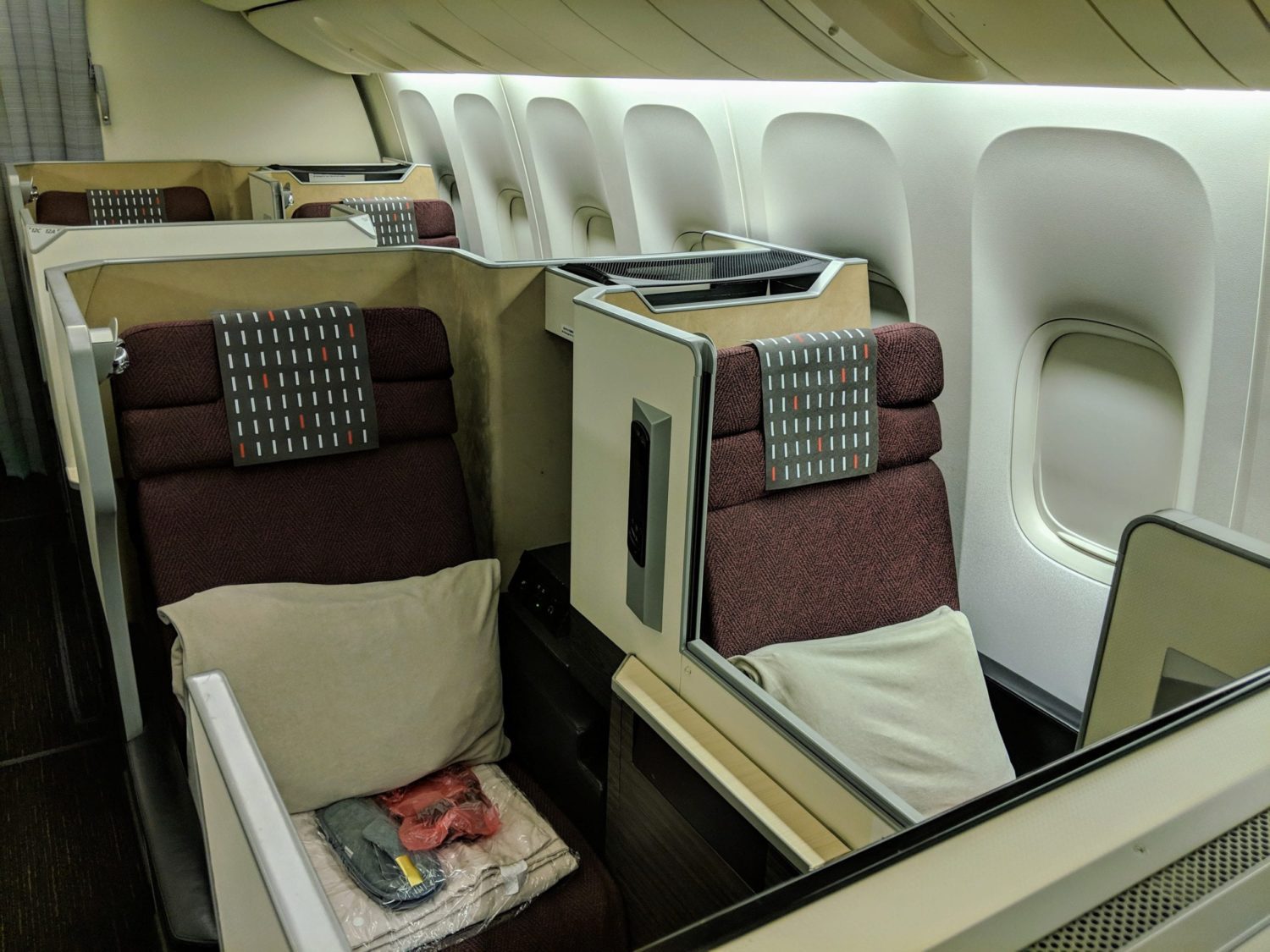 a pair of business class seats next to each other
