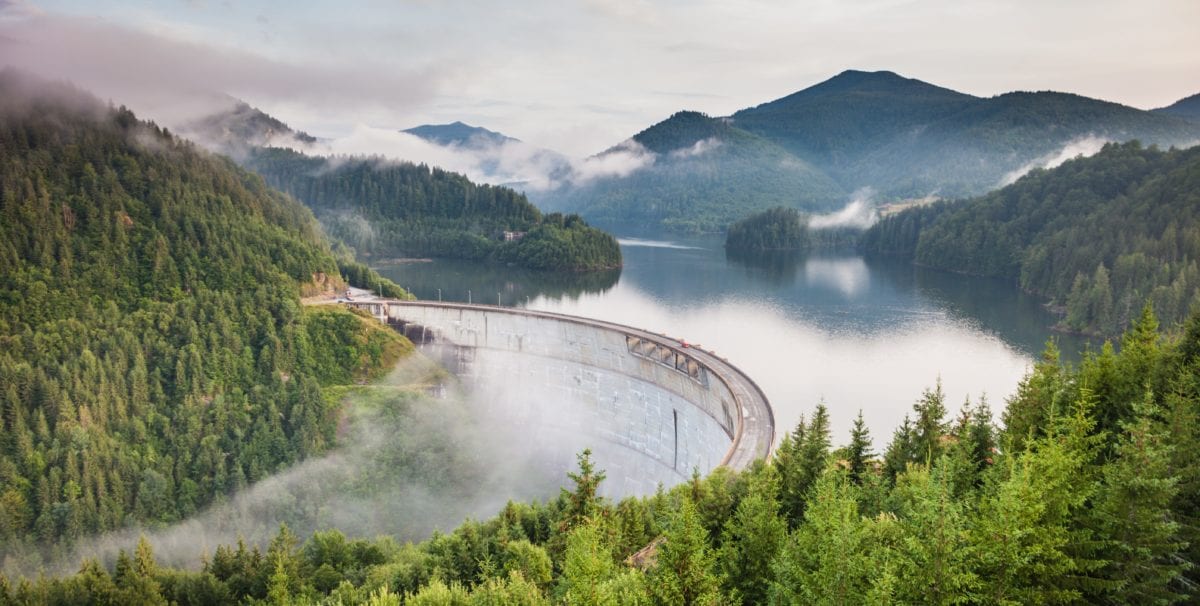 A train crossing a bridge over a body of water