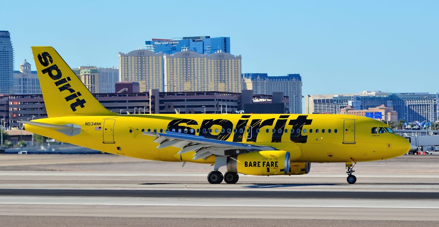 spirit airlines plane on a runway