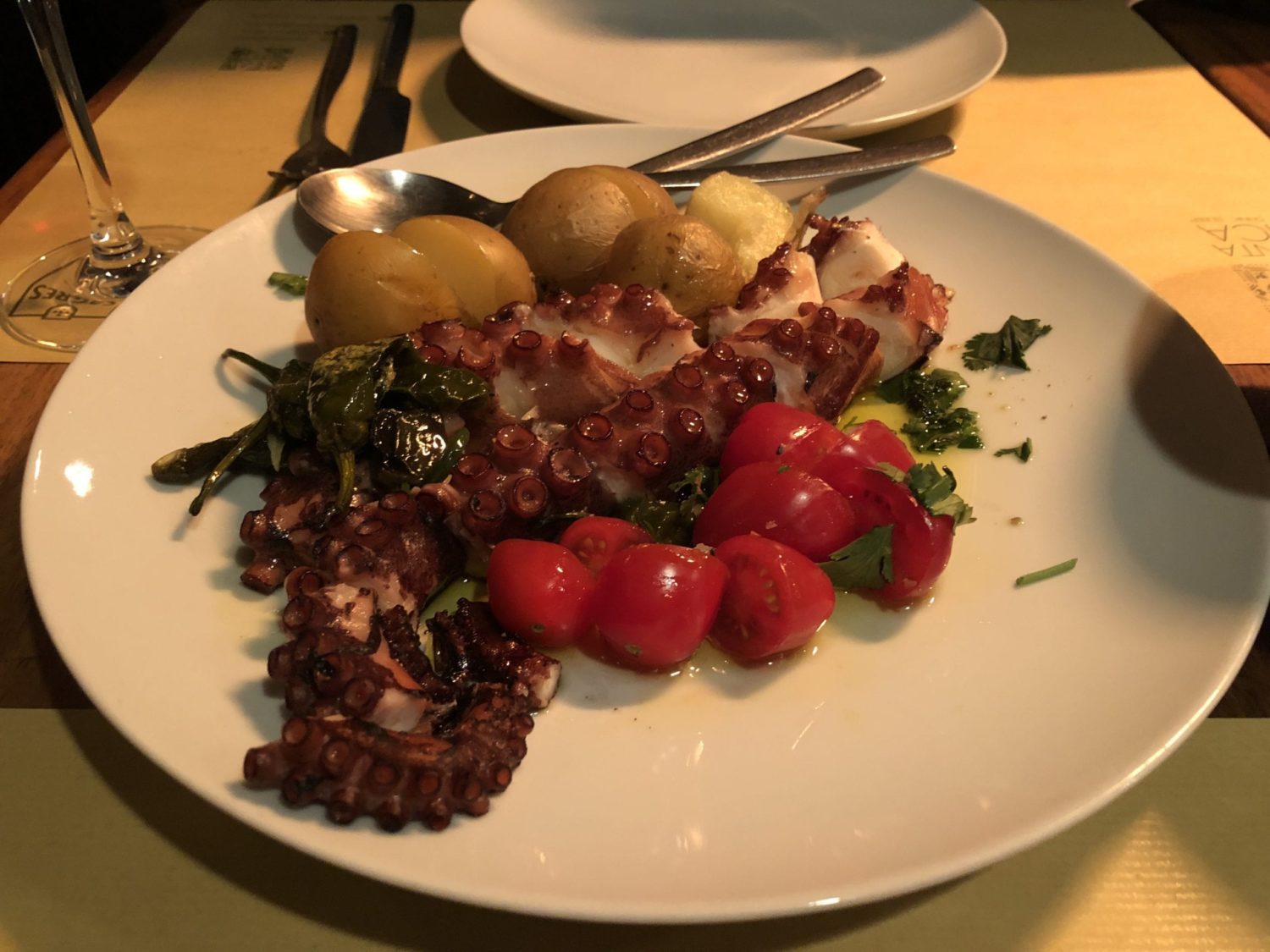 A plate of food on a table in Lisbon and Portugal