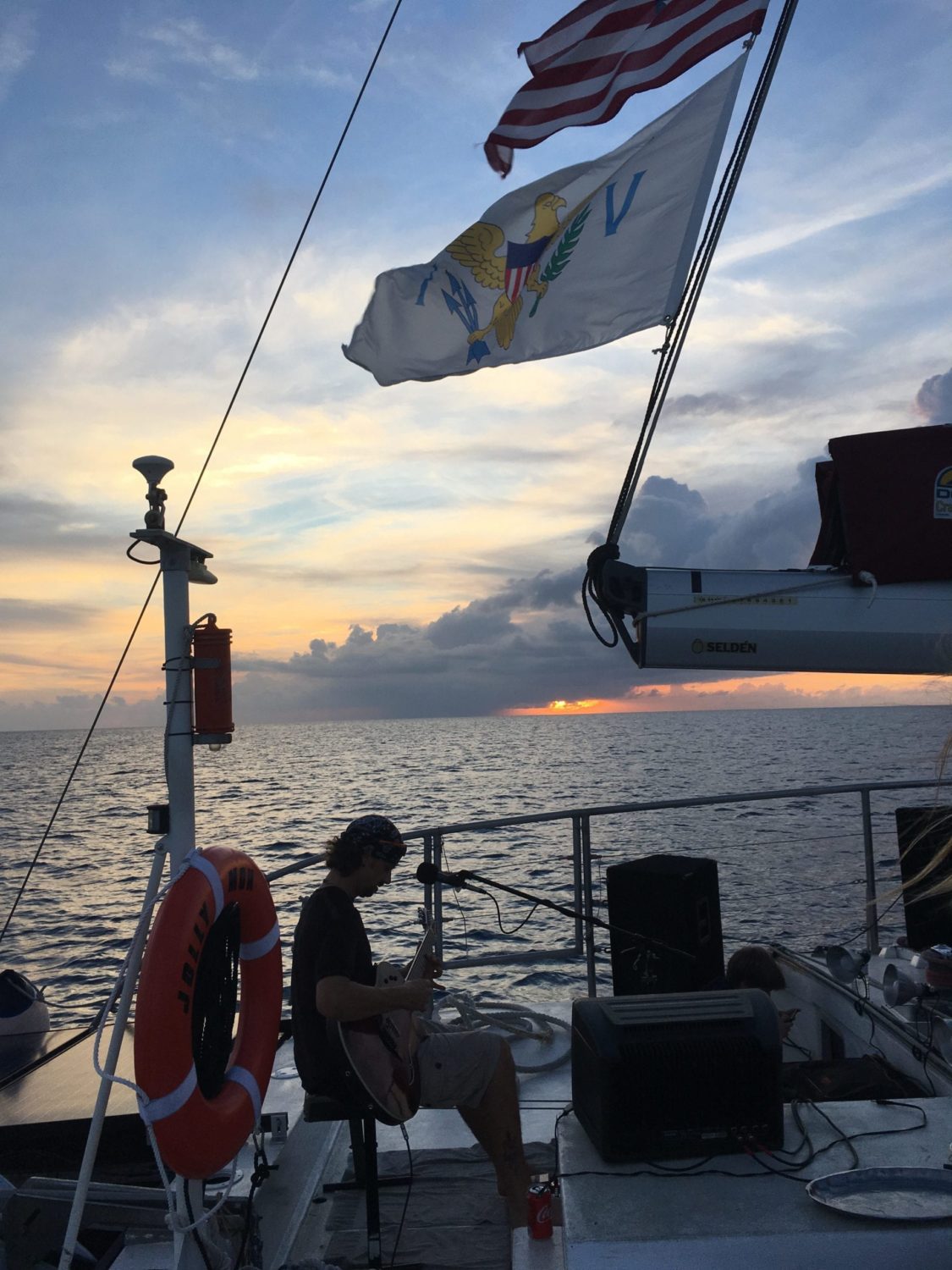 A group of people in a boat on a body of water