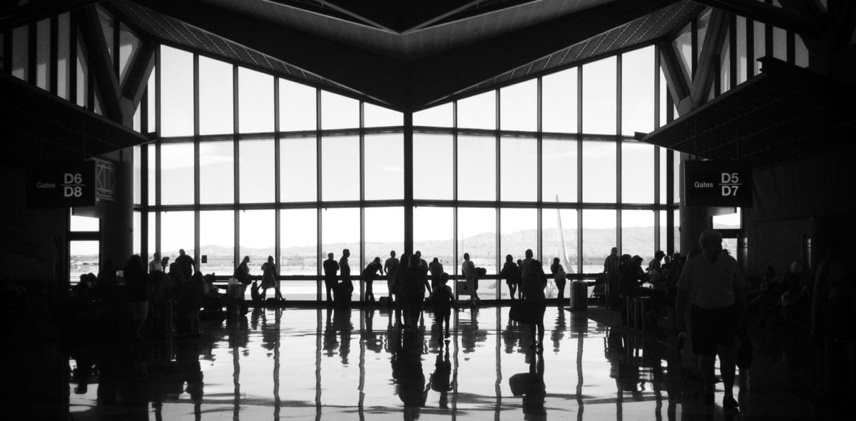 A group of people standing in front of a building