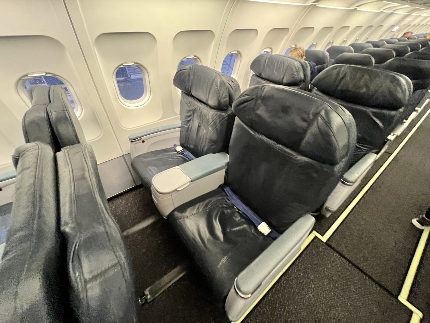 large blue recliner style seats on a plane