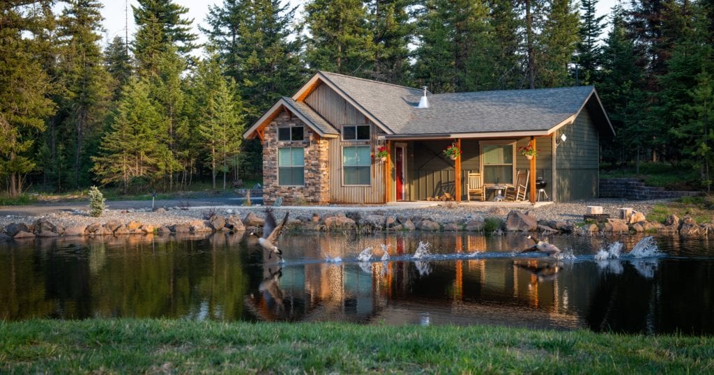 Hotel or Airbnb? How to Choose for Your Next Trip 1 A small house surrounded by water