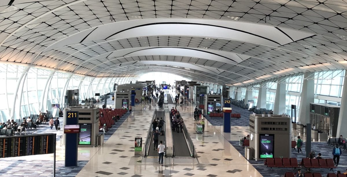 A group of people sitting at a train station