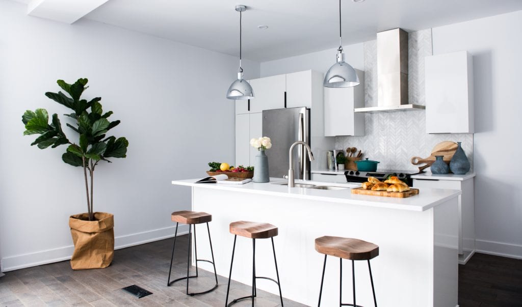 Hotel or Airbnb? How to Choose for Your Next Trip 3 A kitchen with an island in the middle of a living room