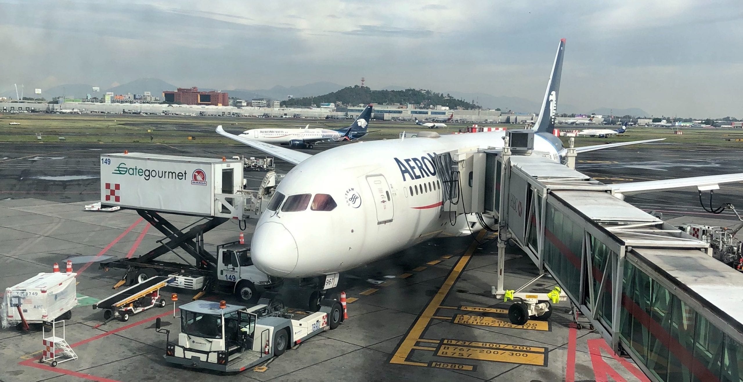 A large passenger jet sitting on top of a tarmac at an airport