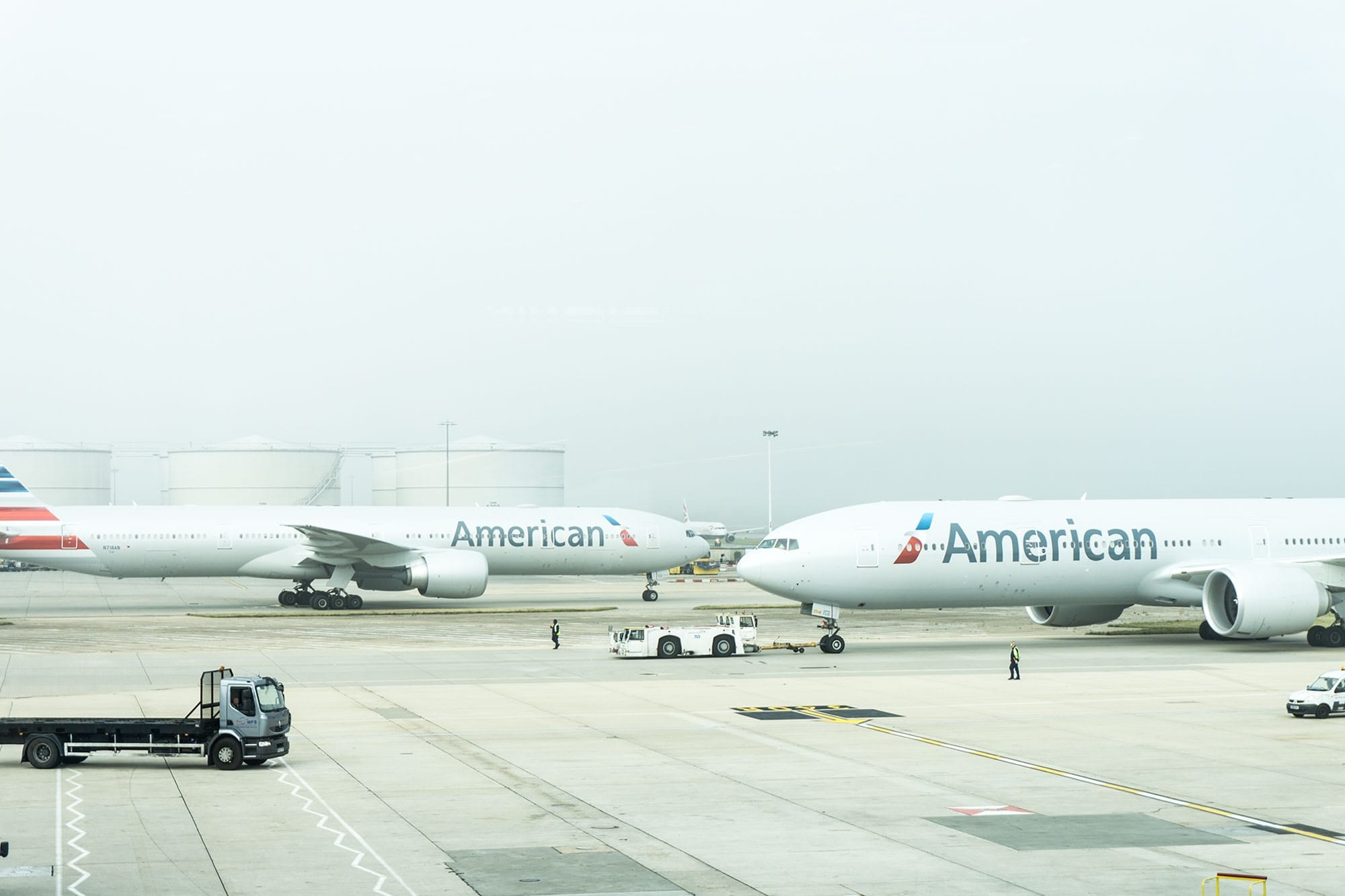A large passenger jet sitting on top of a tarmac at an airport