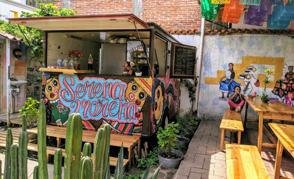 Don't Miss Oaxaca, Mexico's Up-and-Coming Hot Spot 13 A table topped with graffiti on the side of a building