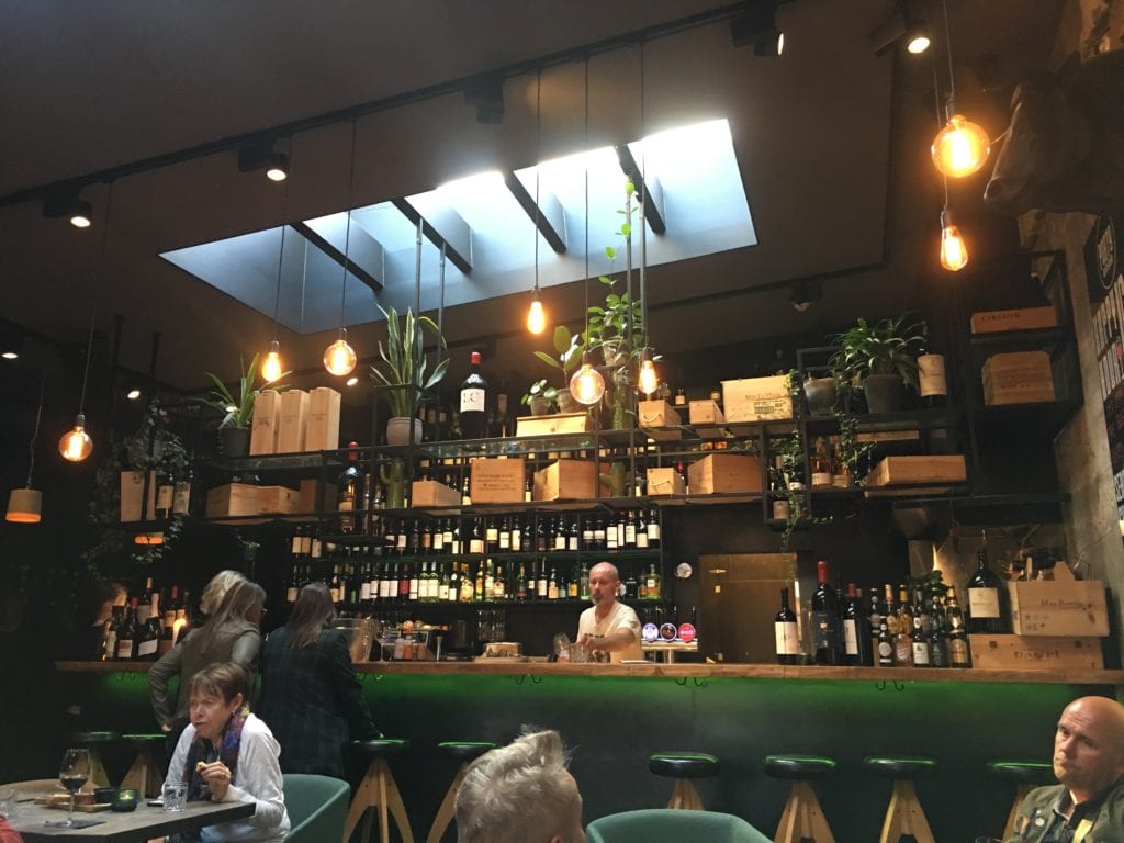 A group of people sitting at a table in a restaurant