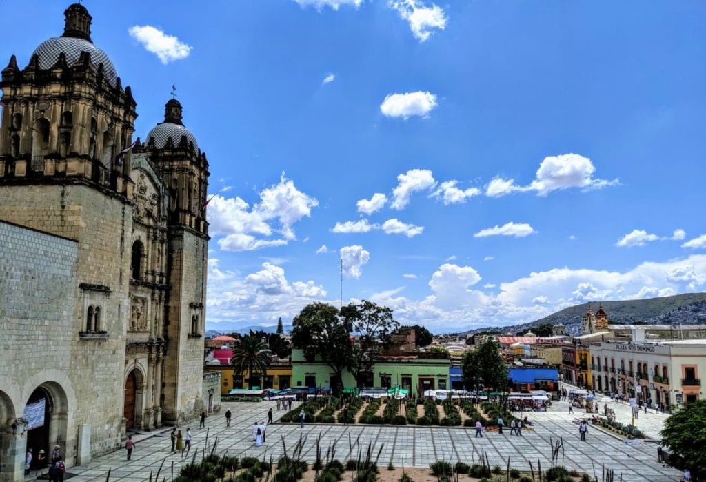 A group of people walking in front of a building