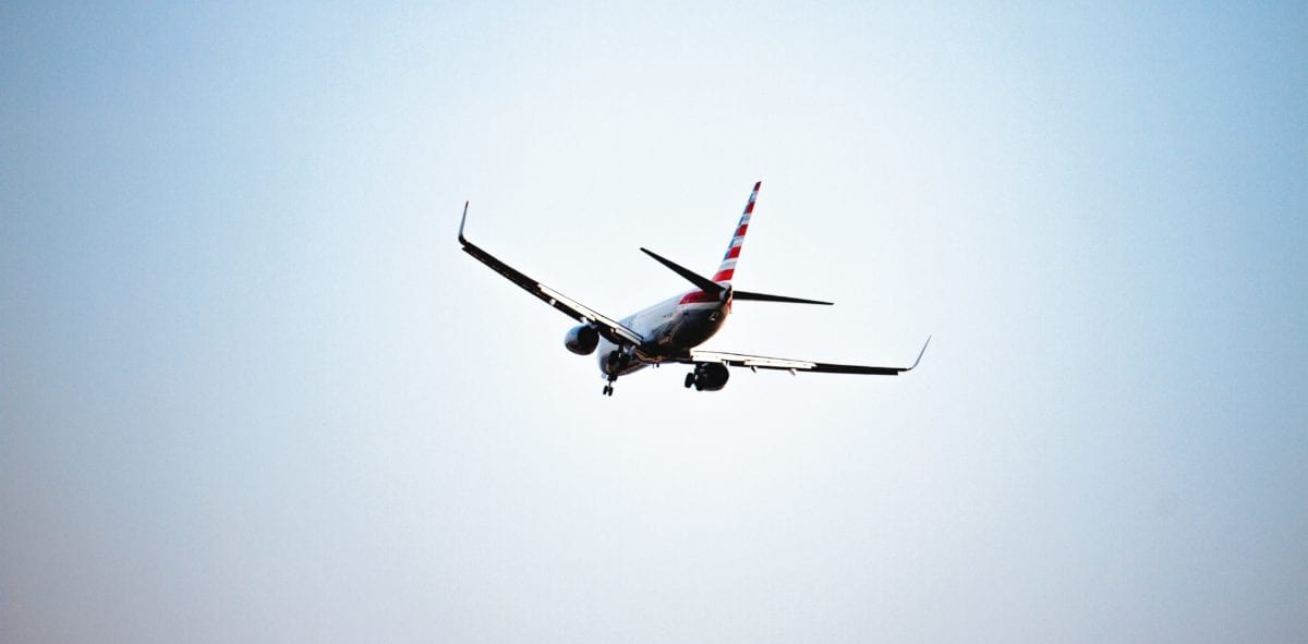 A plane flying high up in the air