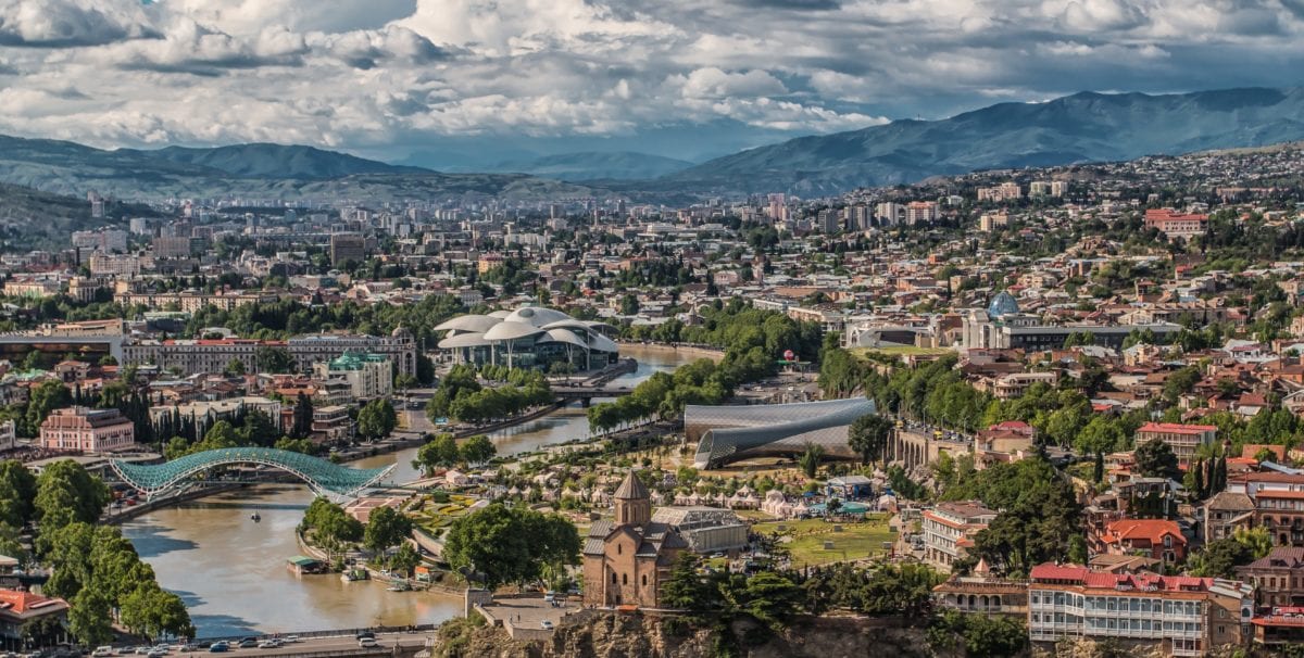 A view of a city with a mountain in the background
