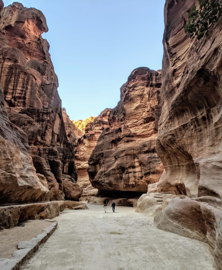 A canyon with a mountain in the background