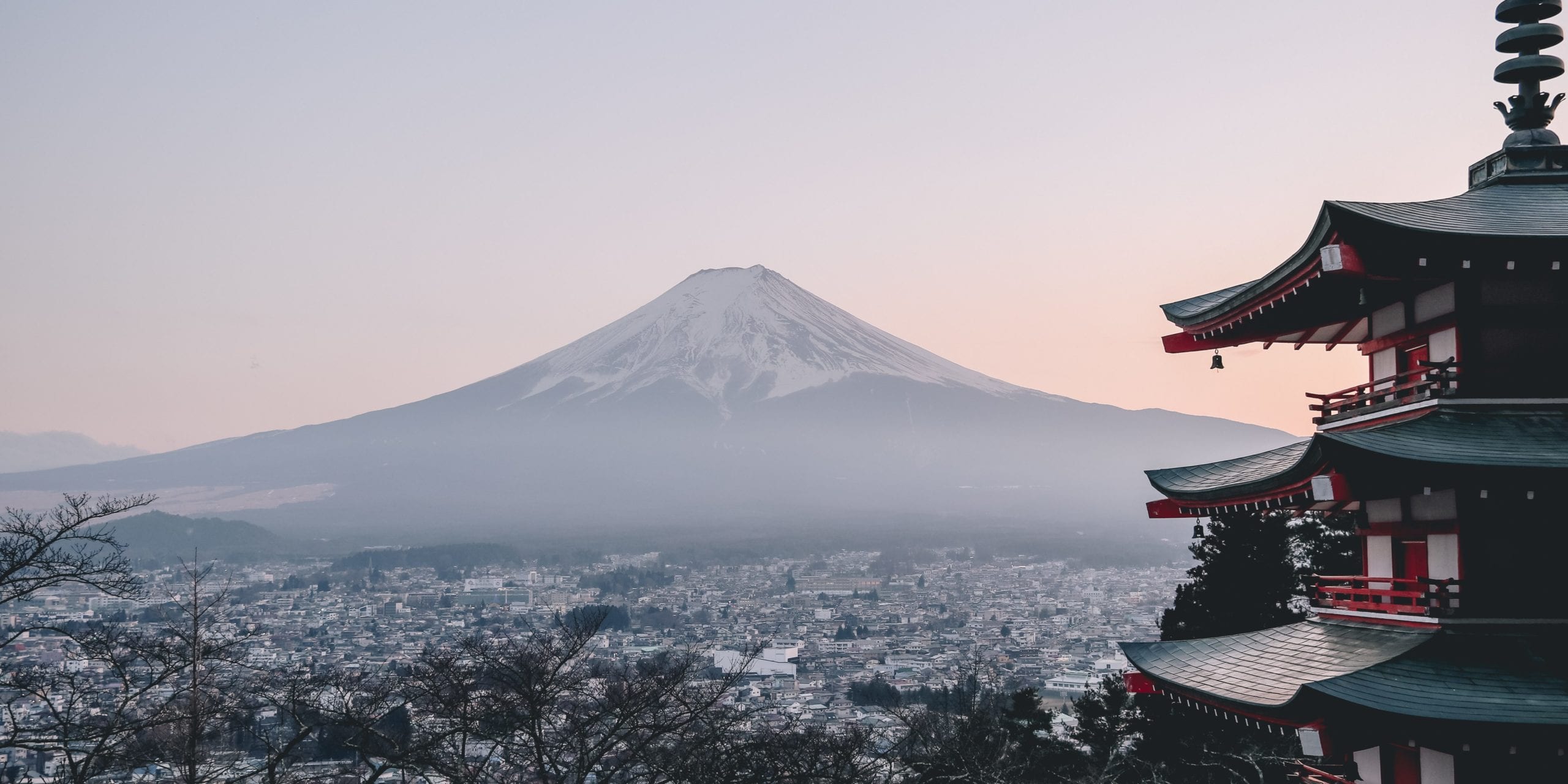 A large body of water with a mountain in the background