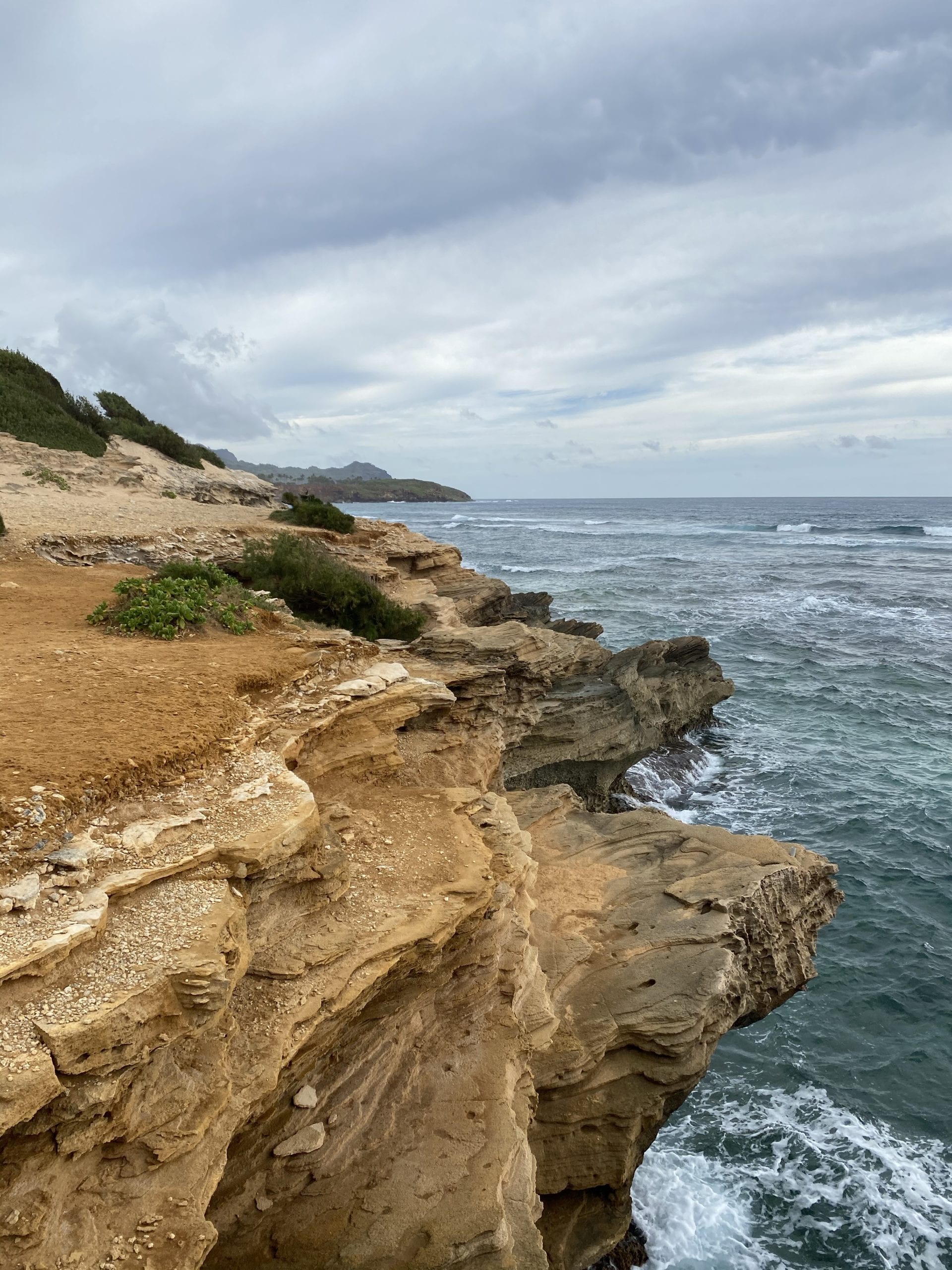 rocky orange cliffs over the ocean