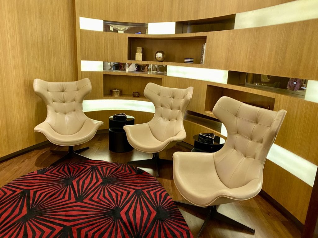 etihad first class lounge cigar room seating