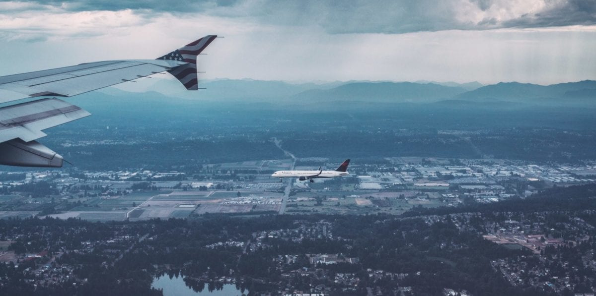 A plane flying over a body of water