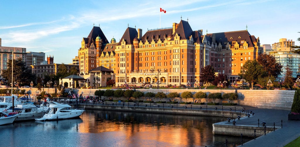 Fairmont Hotels Promo: Buy One, Get One Through 2020 1 The Empress over a body of water with a city in the background