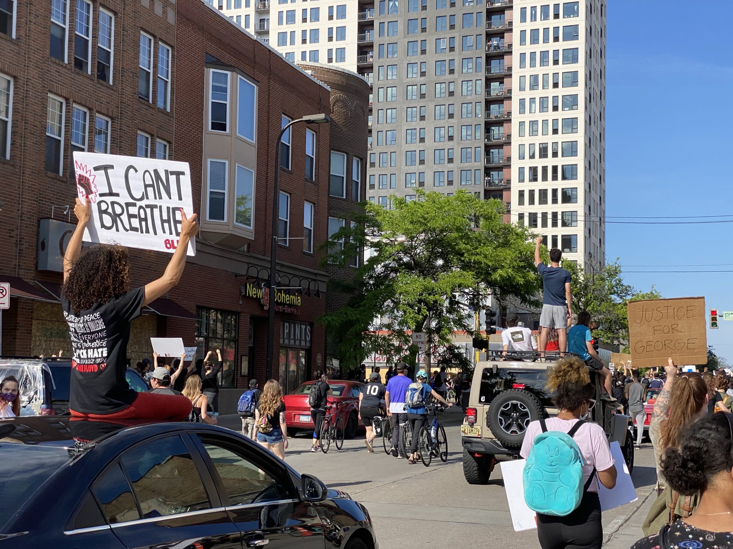 Mourning for George Floyd, Our City, and Our Country 1 A group of people on a city street
