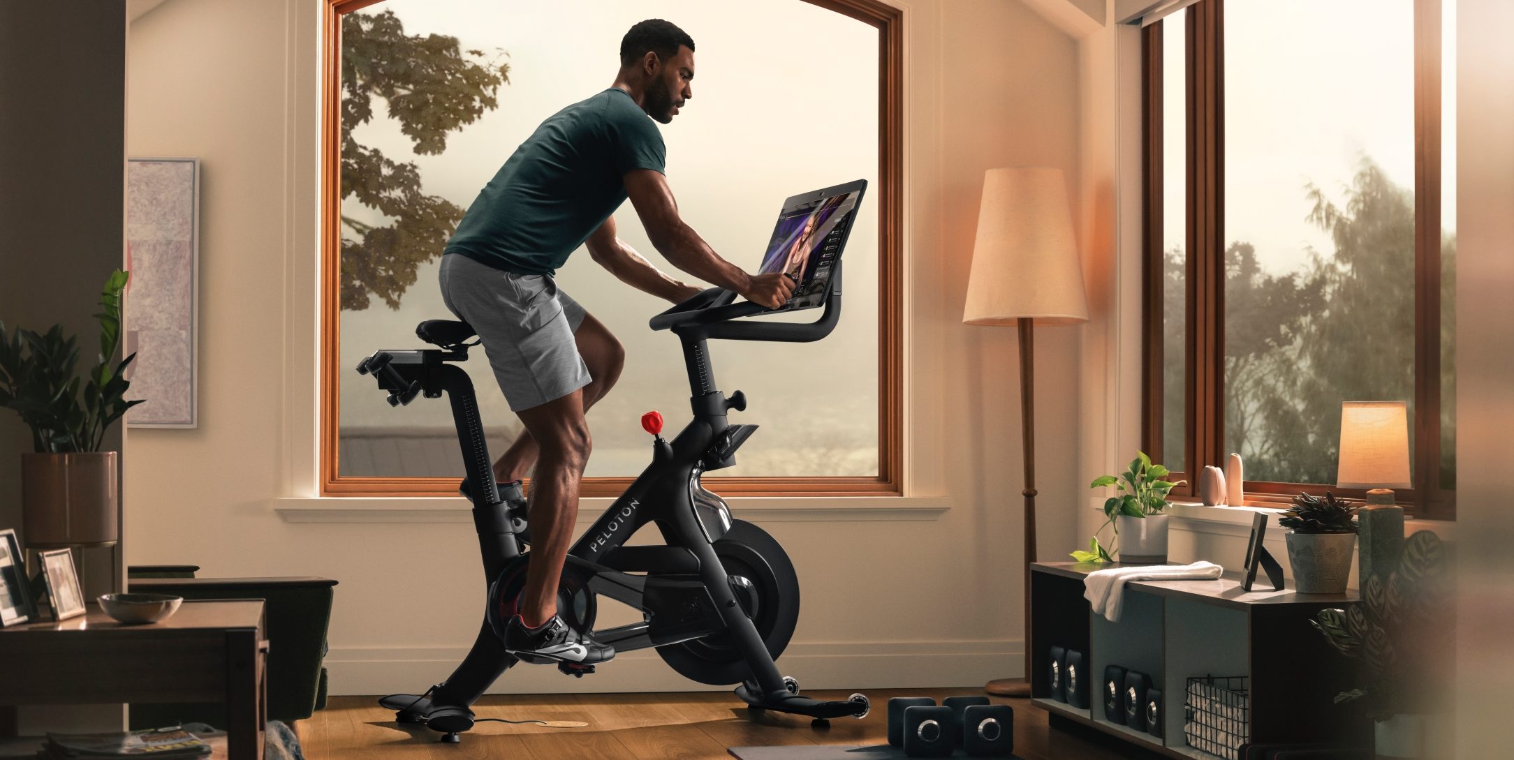 a man riding a peloton bike