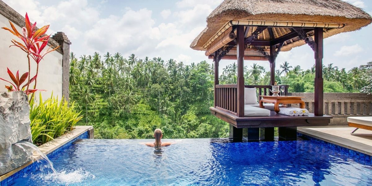 a woman swimming in a pool of water