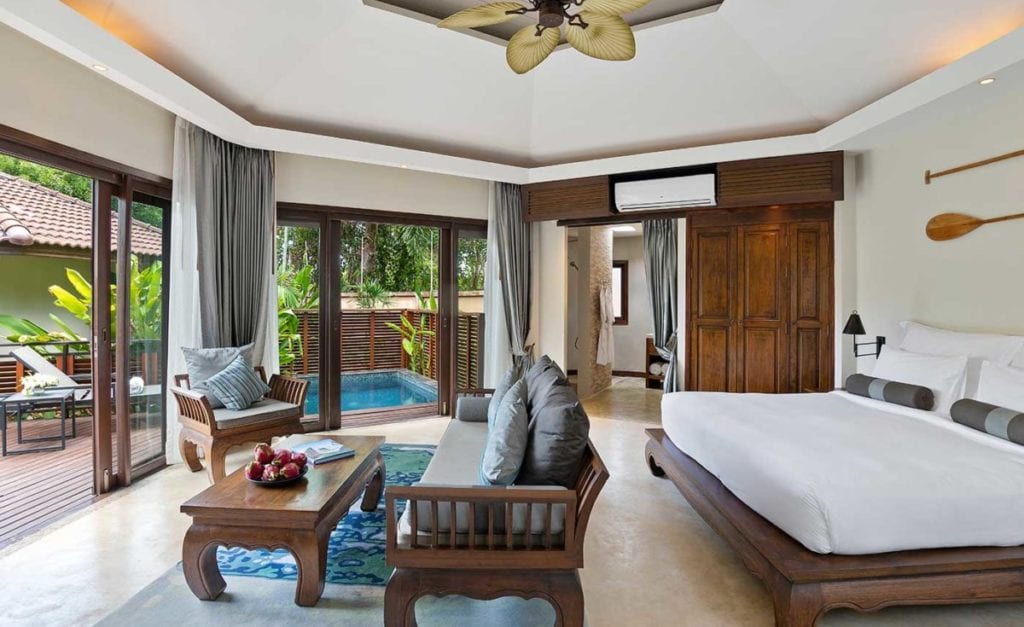 A living room filled with furniture and a large window