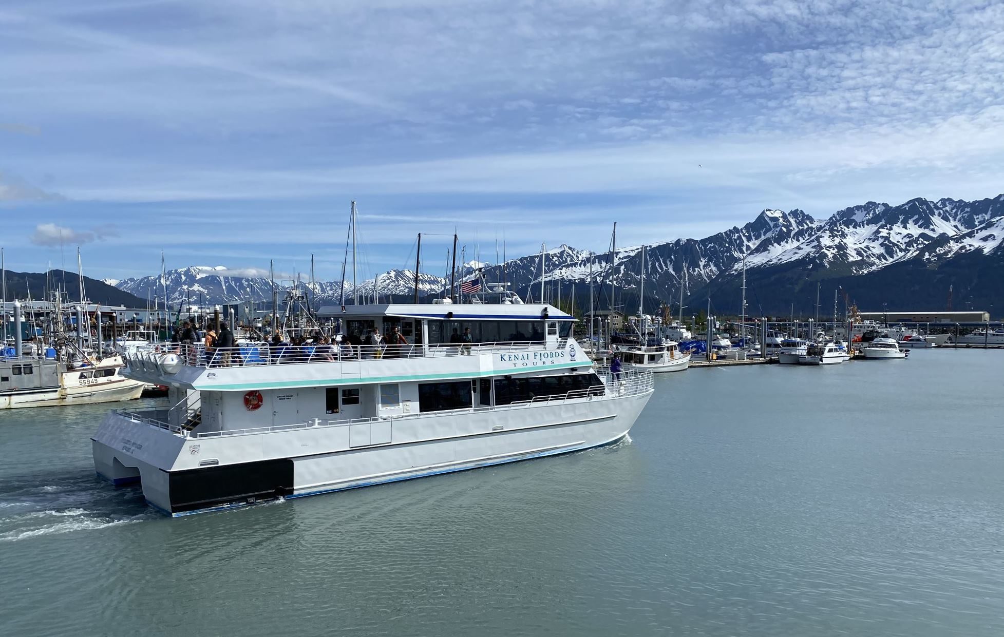 A boat is docked next to a body of water