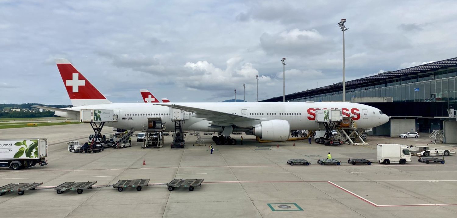 A large passenger jet sitting on top of a tarmac at an airport