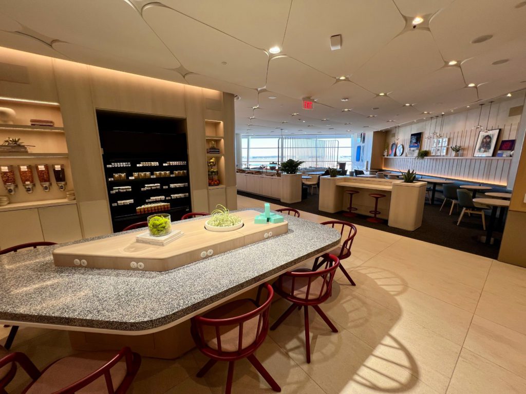 The Best There Is: Capital One Lounge in Dallas-Fort Worth (DFW) Review 29 a long table with chairs and natural light