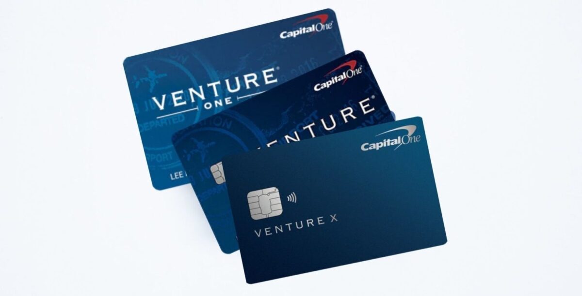 three capital one venture cards stacked on top of each other